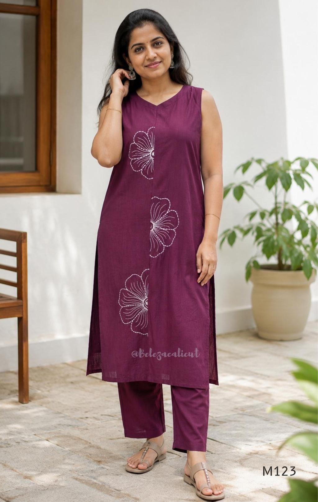 Plum purple Vertigan silk coord set with white floral embroidery and straight pants.