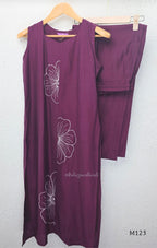 Plum purple Vertigan silk coord set with white floral embroidery and straight pants.