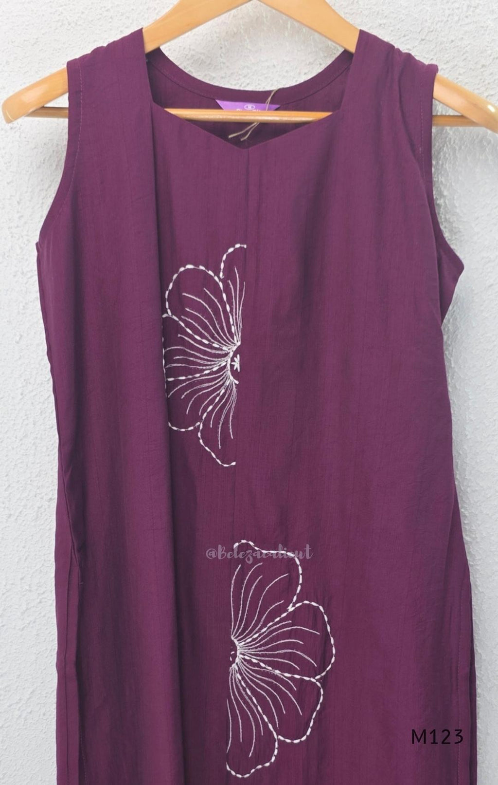 Plum purple Vertigan silk coord set with white floral embroidery and straight pants.