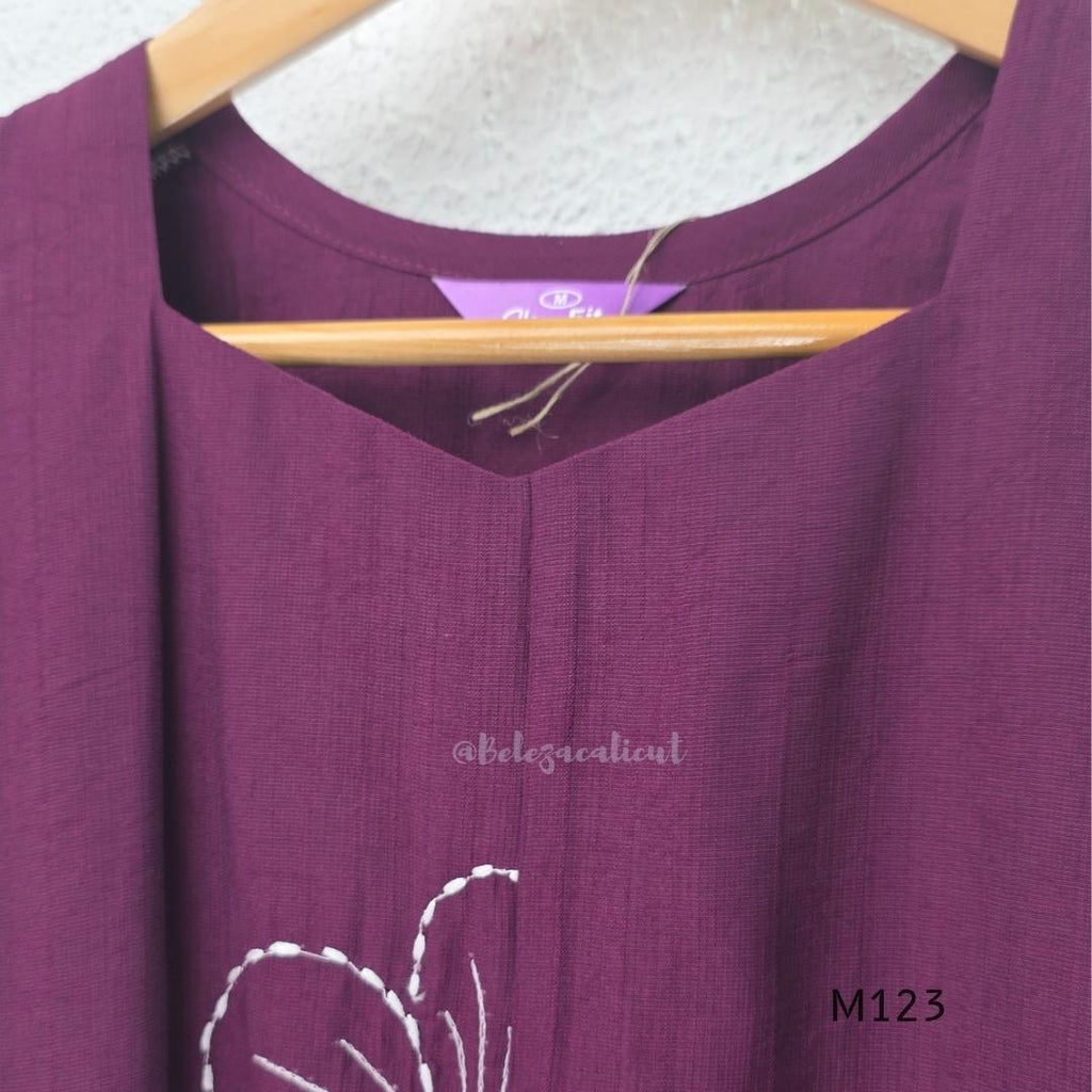 Plum purple Vertigan silk coord set with white floral embroidery and straight pants.
