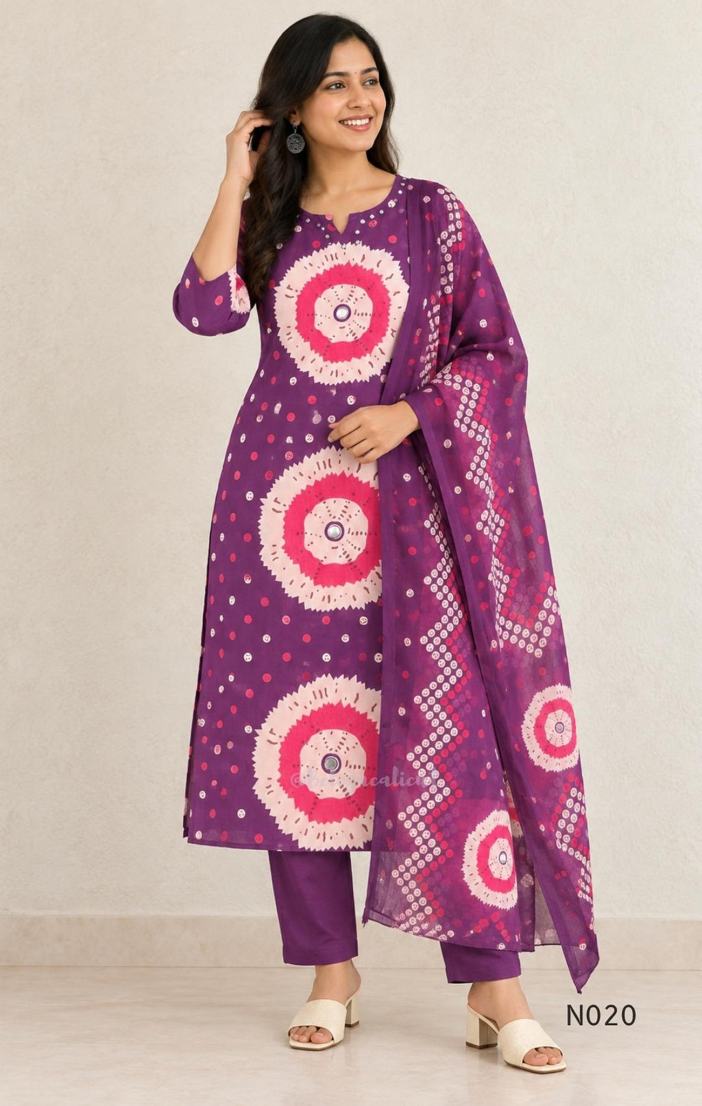 Purple cotton churidar set with pink and cream circular print, real mirror details and matching printed dupatta.