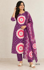 Purple cotton churidar set with pink and cream circular print, real mirror details and matching printed dupatta.