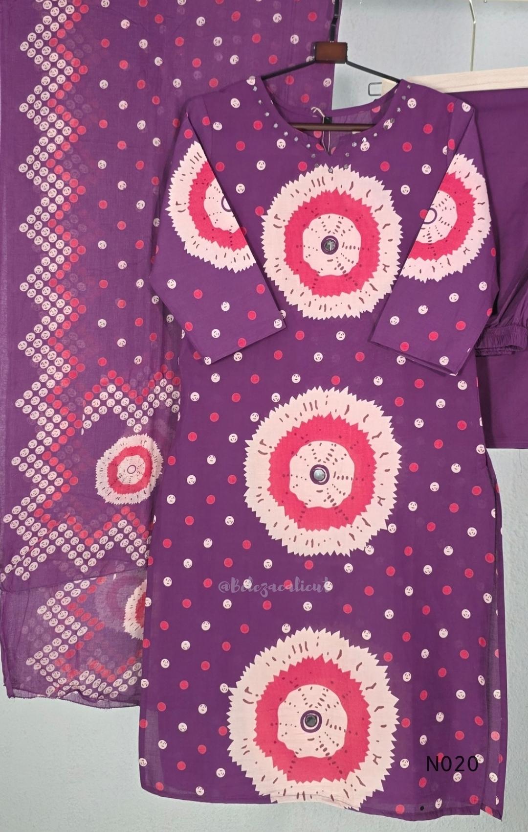 Purple cotton churidar set with pink and cream circular print, real mirror details and matching printed dupatta.