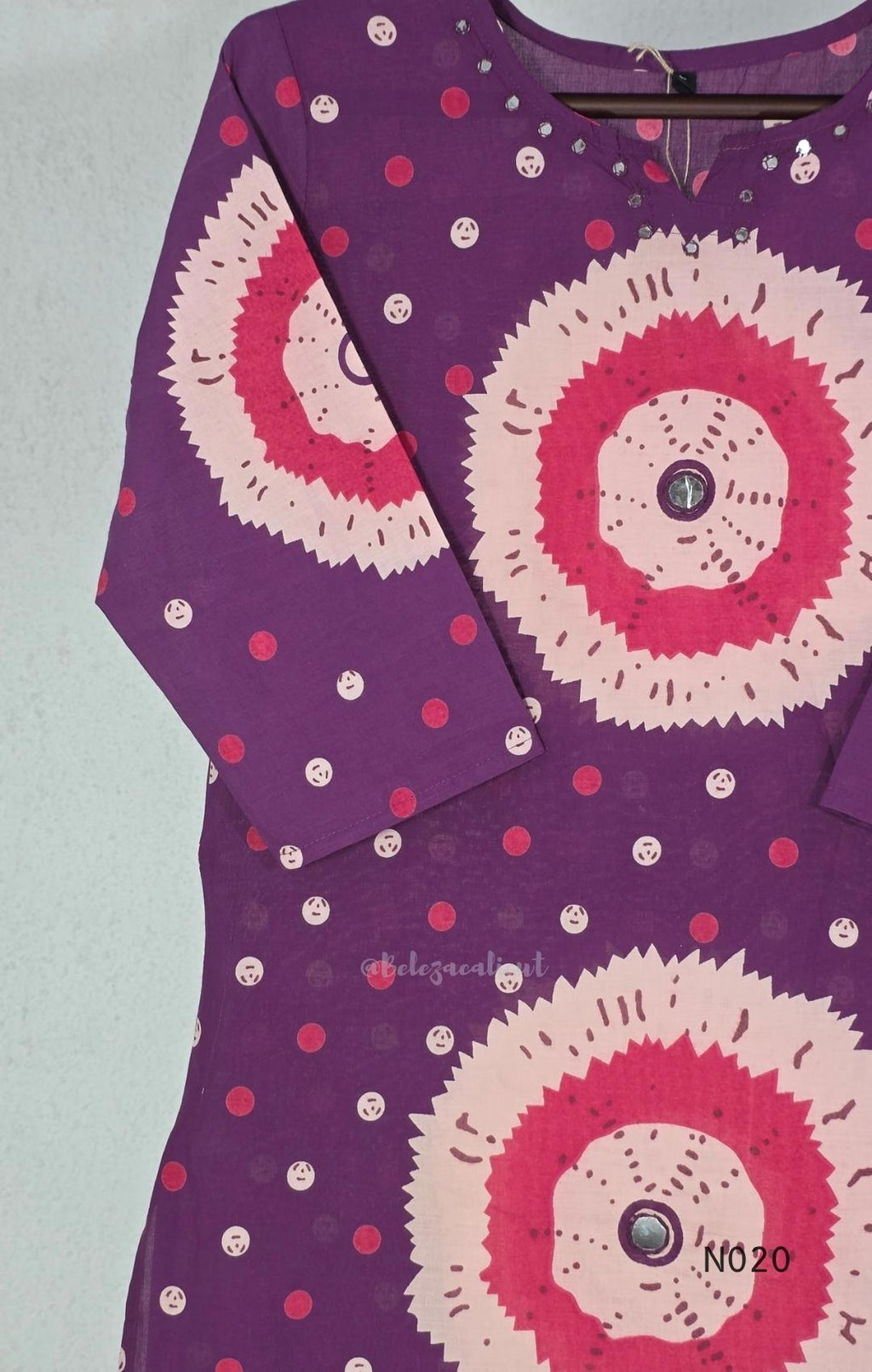 Purple cotton churidar set with pink and cream circular print, real mirror details and matching printed dupatta.
