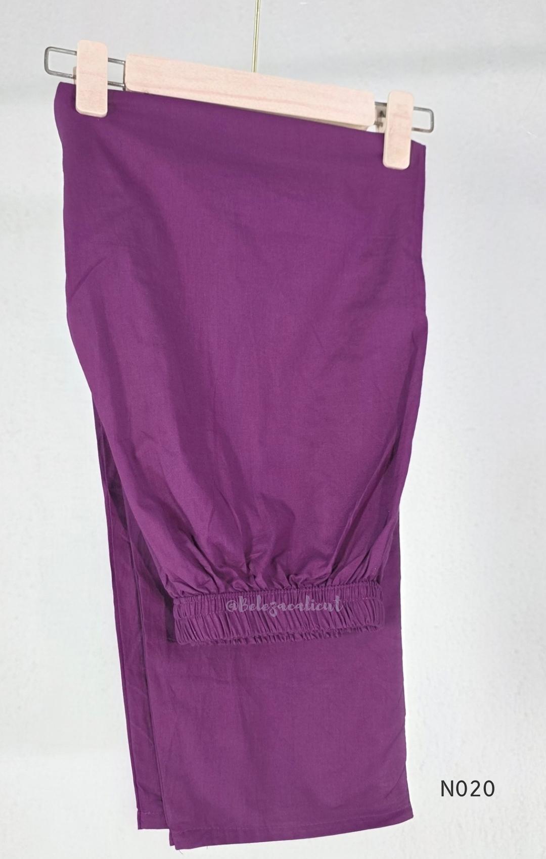 Purple cotton churidar set with pink and cream circular print, real mirror details and matching printed dupatta.