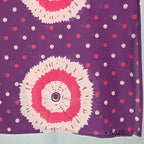 Purple cotton churidar set with pink and cream circular print, real mirror details and matching printed dupatta.