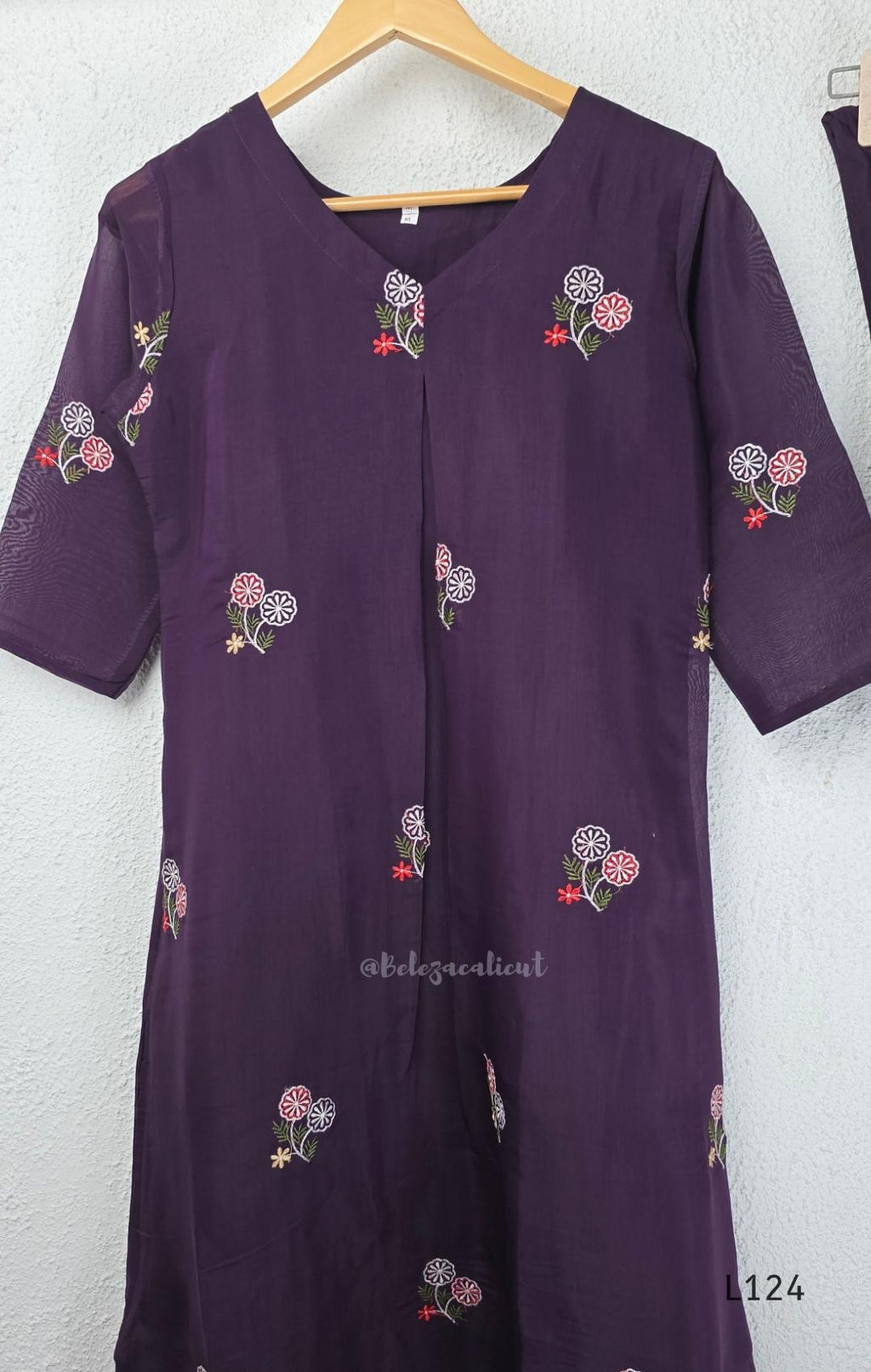 Deep purple Mul Chanderi top and bottom coord set with scattered multicolour floral embroidery.