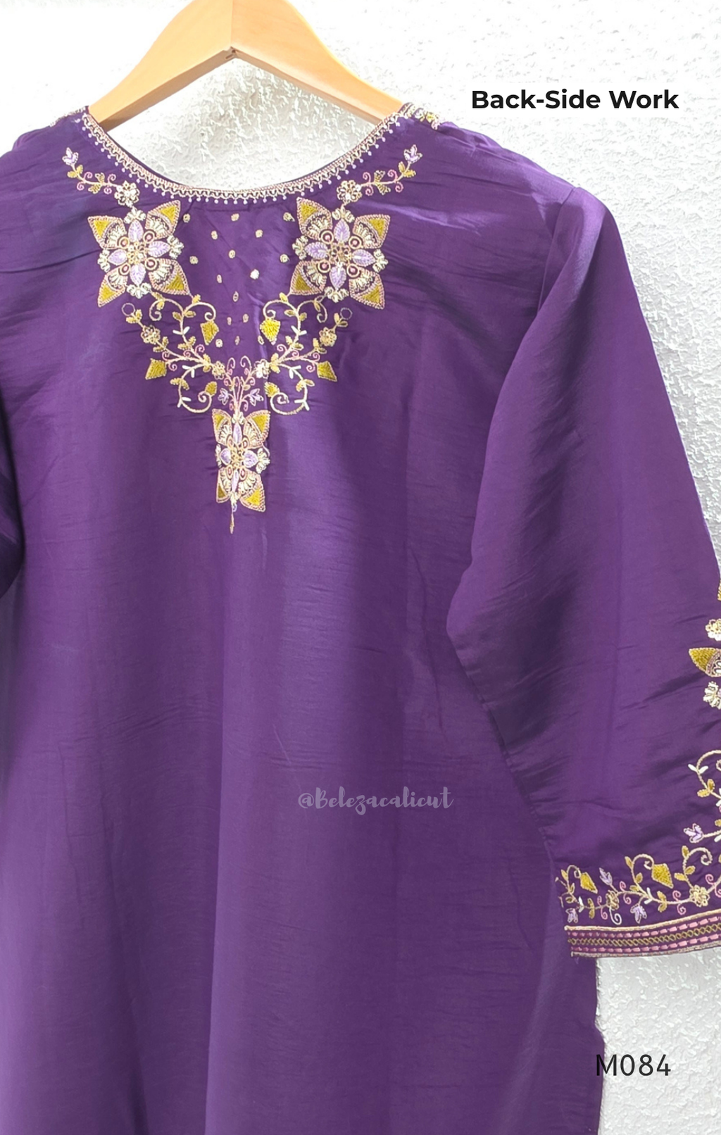 Purple premium Roman silk plus size churidar set with embroidered neckline, sleeve detail, back work, matching bottom and dupatta.