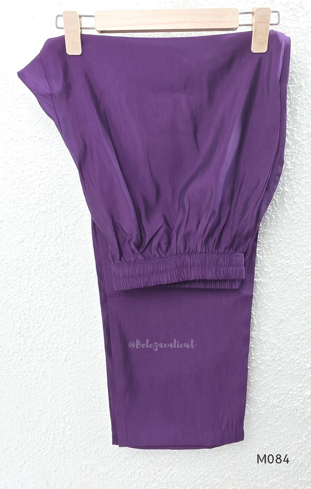 Purple premium Roman silk plus size churidar set with embroidered neckline, sleeve detail, back work, matching bottom and dupatta.