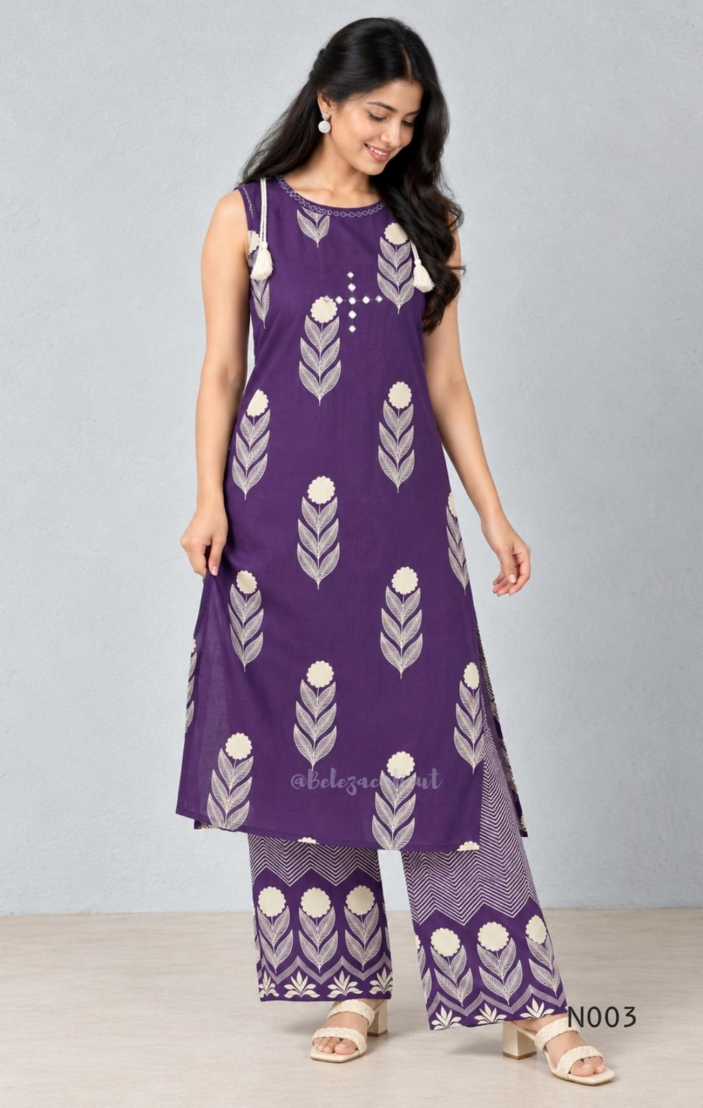 Deep purple cotton top and bottom set with cream floral-leaf print, mirror-style front detail and printed wide-fit pants from Beleza, Mankavu, Calicut.