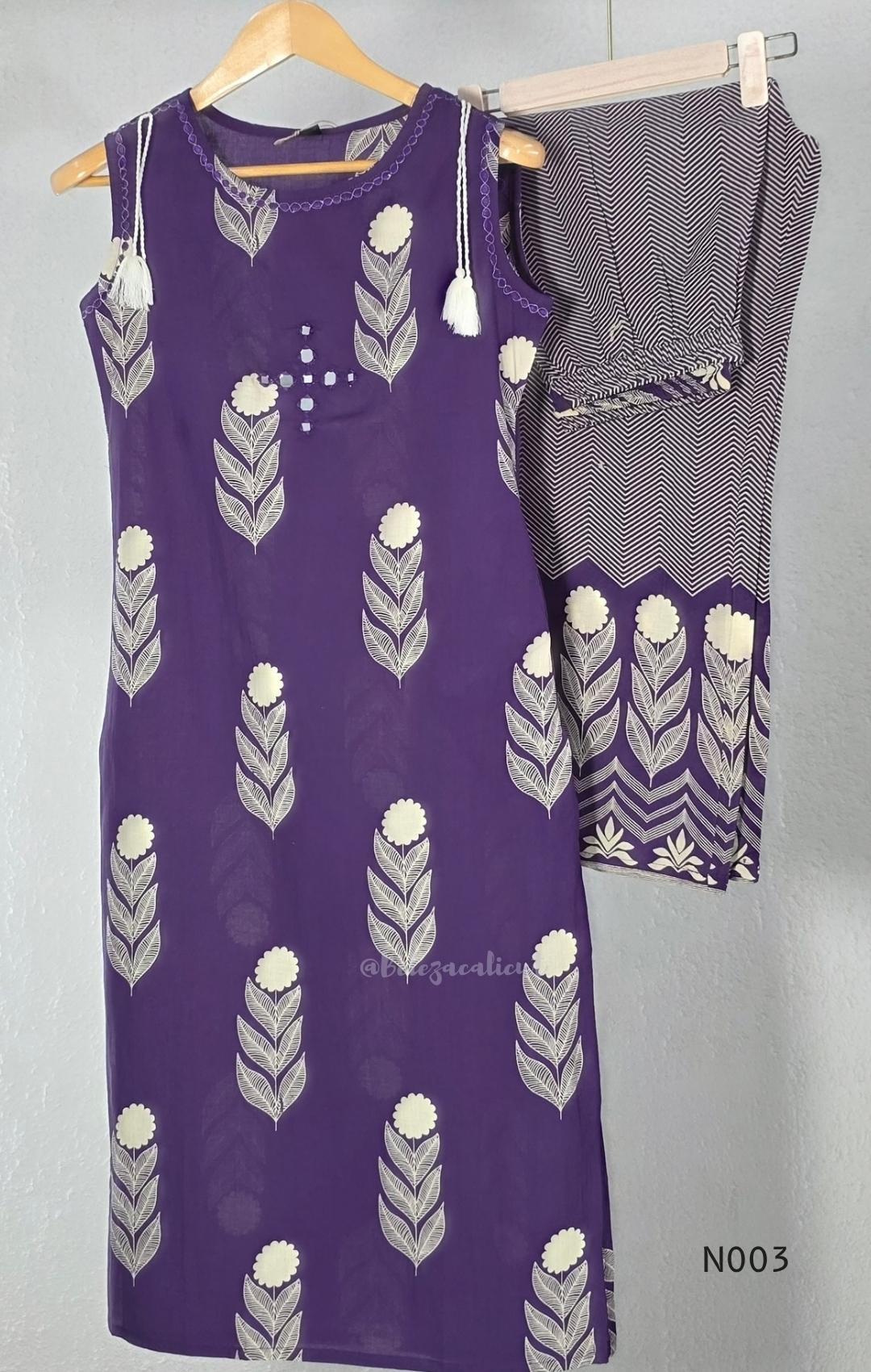 Deep purple cotton top and bottom set with cream floral-leaf print, mirror-style front detail and printed wide-fit pants from Beleza, Mankavu, Calicut.