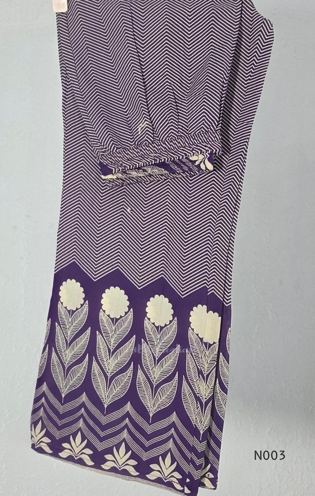 Deep purple cotton top and bottom set with cream floral-leaf print, mirror-style front detail and printed wide-fit pants from Beleza, Mankavu, Calicut.