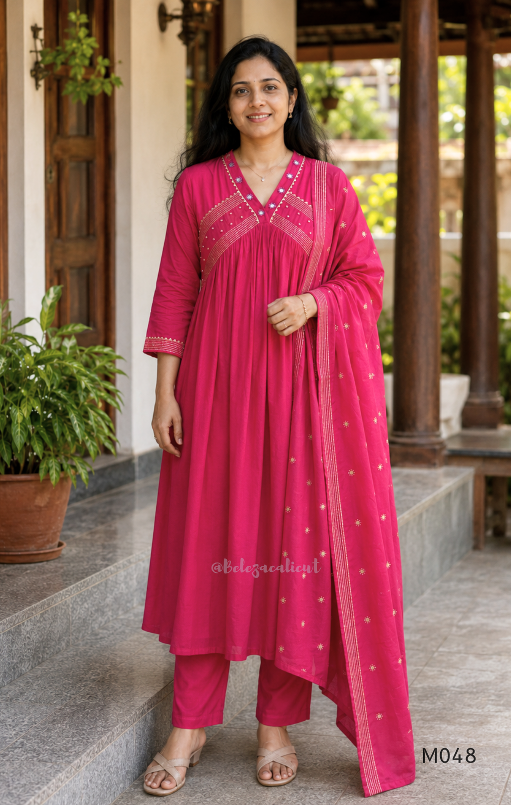 Rani pink cotton churidar suit set with matching bottom and dupatta, mirror detail V-neckline, gold line work on yoke, and festive casual styling.
