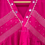 Rani pink cotton churidar suit set with matching bottom and dupatta, mirror detail V-neckline, gold line work on yoke, and festive casual styling.