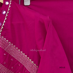 Rani pink cotton churidar suit set with matching bottom and dupatta, mirror detail V-neckline, gold line work on yoke, and festive casual styling.