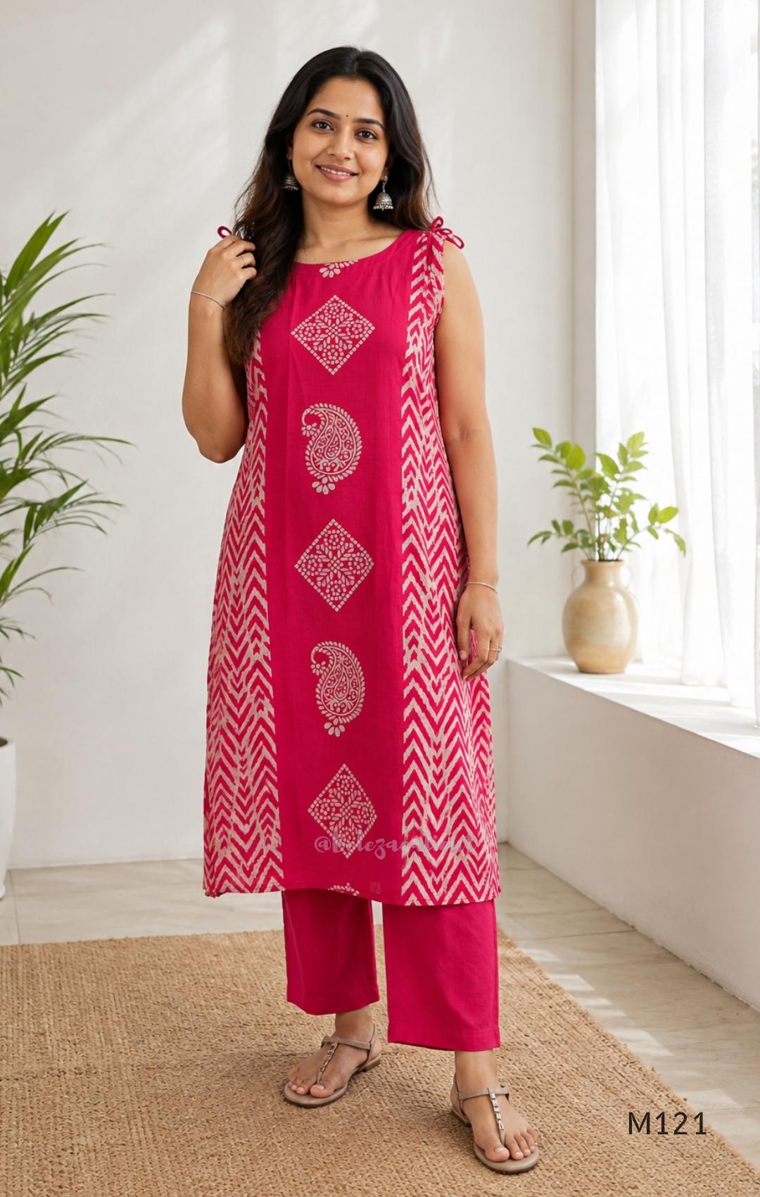 Rani pink Vertigan silk two-piece co-ord set with beige central motifs, chevron side panels and matching straight pants.