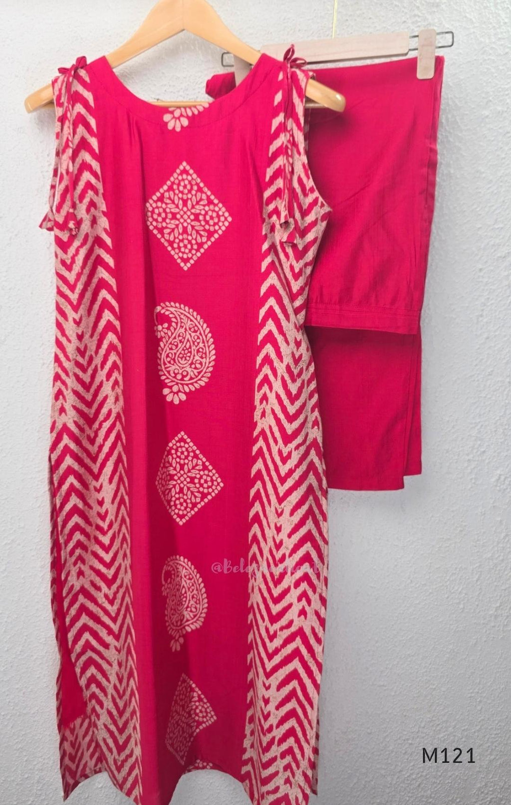 Rani pink Vertigan silk two-piece co-ord set with beige central motifs, chevron side panels and matching straight pants.