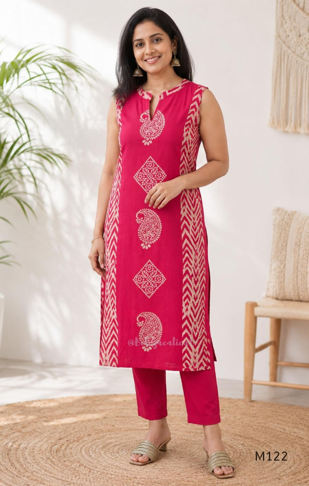 Raspberry pink Vertigan silk two-piece co-ord set with beige paisley, diamond and chevron print and matching straight pants.