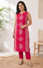Raspberry pink Vertigan silk two-piece co-ord set with beige paisley, diamond and chevron print and matching straight pants.