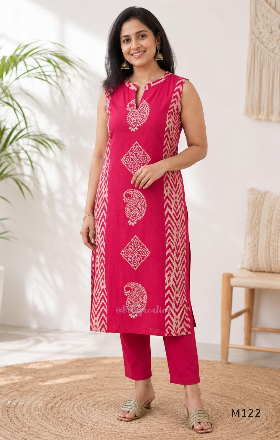 Raspberry pink Vertigan silk two-piece co-ord set with beige paisley, diamond and chevron print and matching straight pants.