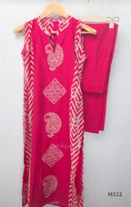 Raspberry pink Vertigan silk two-piece co-ord set with beige paisley, diamond and chevron print and matching straight pants.