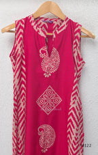 Raspberry pink Vertigan silk two-piece co-ord set with beige paisley, diamond and chevron print and matching straight pants.