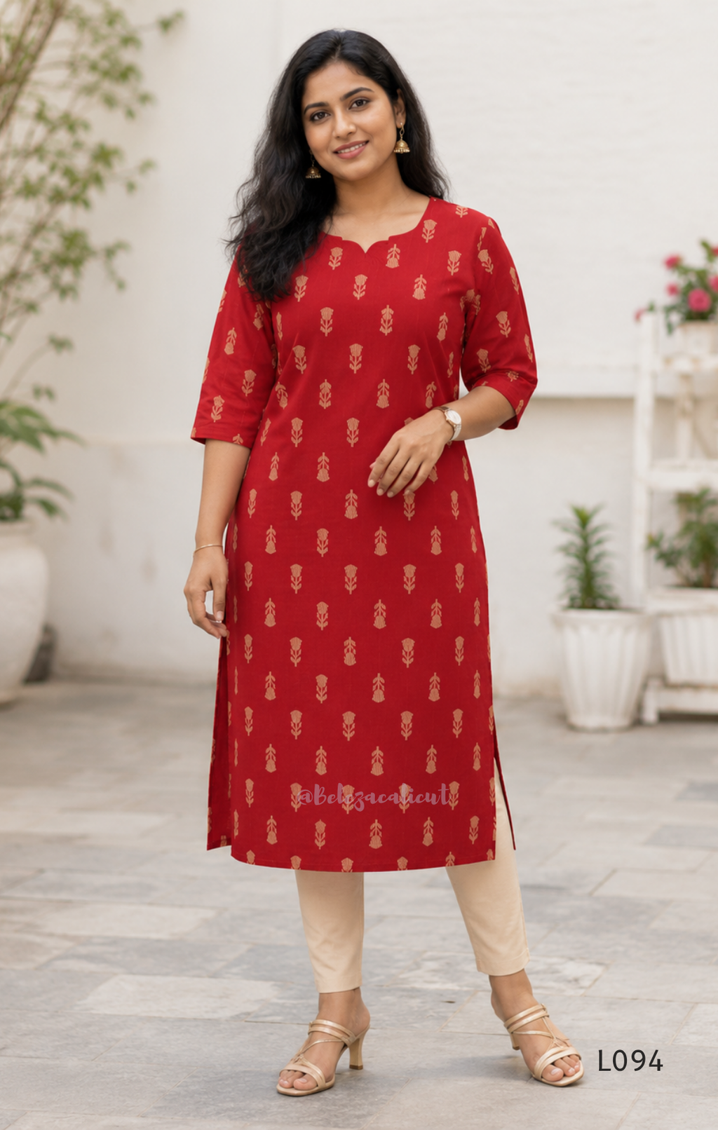 Red cotton women’s top with beige leaf print, small notch neckline, elbow sleeves, and straight everyday fit.
