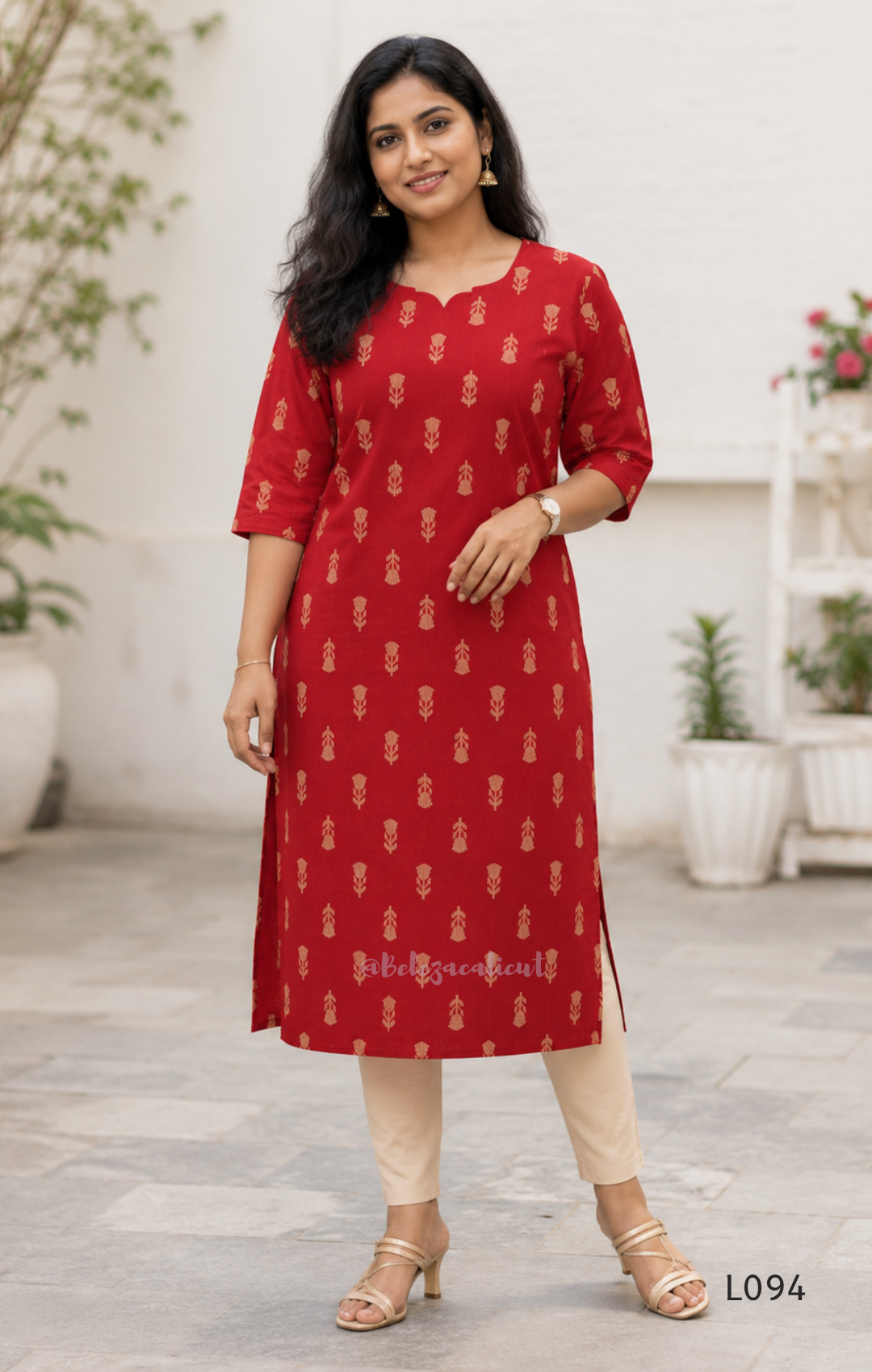 Red cotton women’s top with beige leaf print, small notch neckline, elbow sleeves, and straight everyday fit.