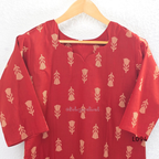 Red cotton women’s top with beige leaf print, small notch neckline, elbow sleeves, and straight everyday fit.