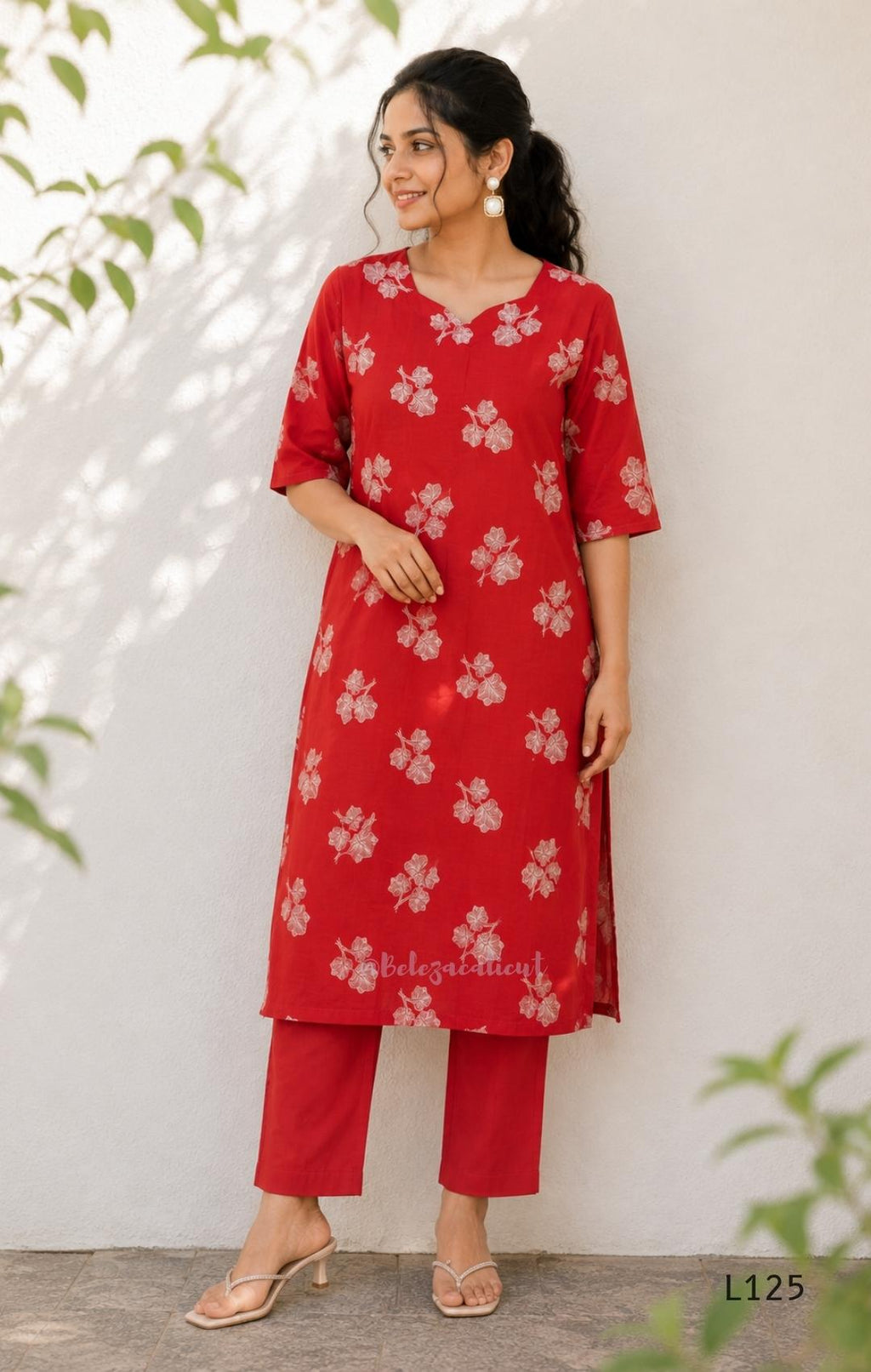 Red mul chanderi coord set with white botanical print top and matching plain straight pants.