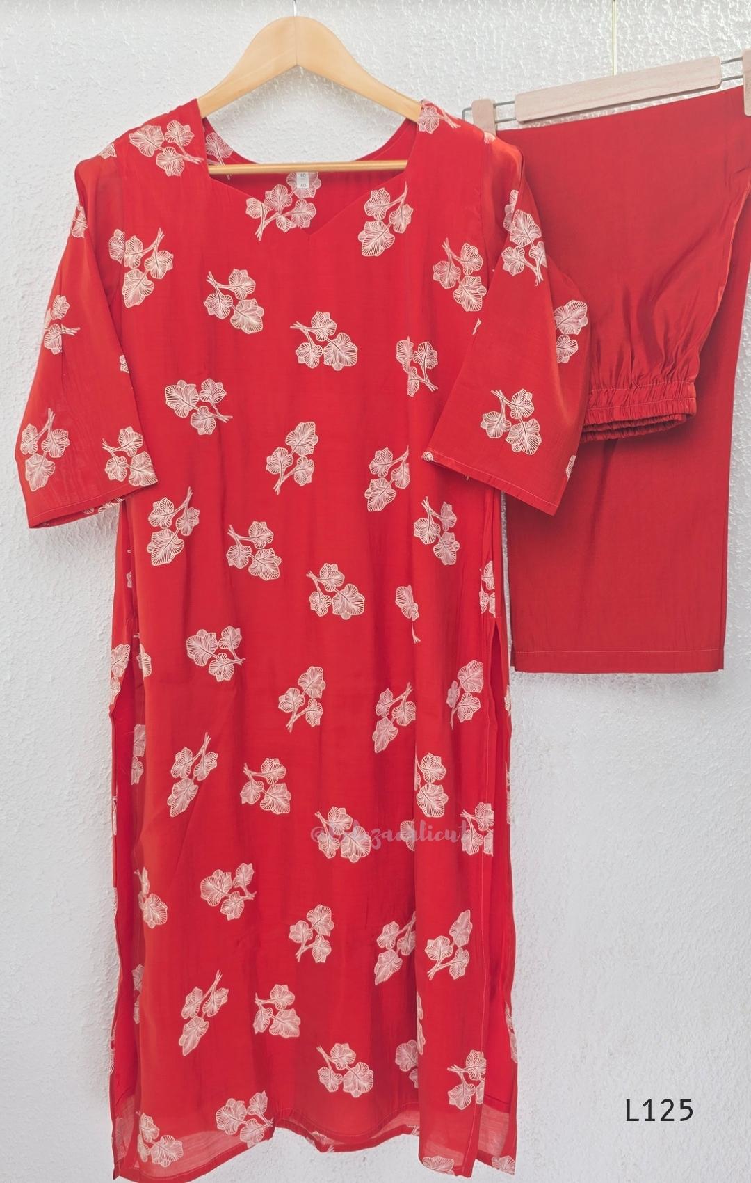 Red mul chanderi coord set with white botanical print top and matching plain straight pants.