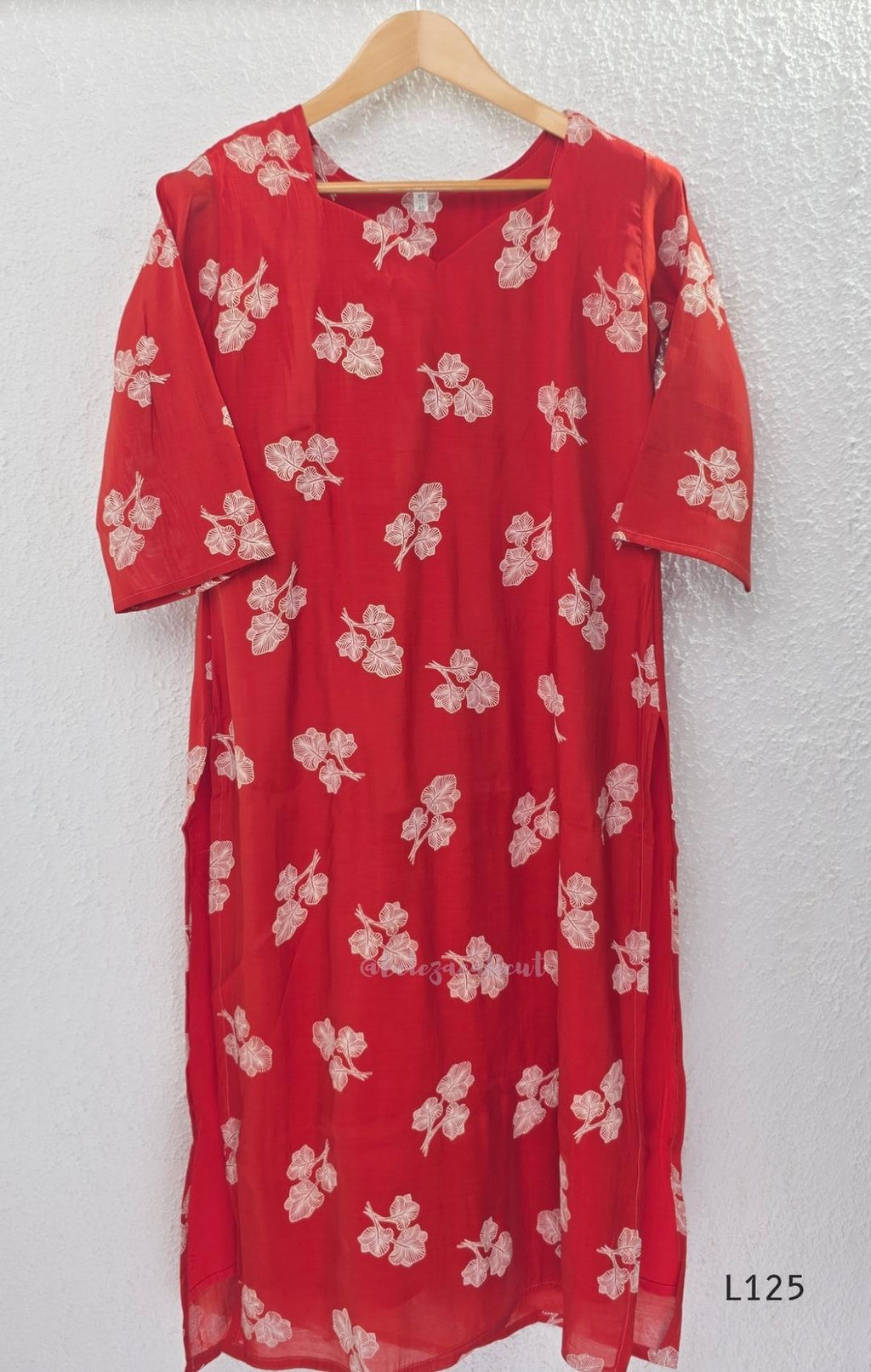 Red mul chanderi coord set with white botanical print top and matching plain straight pants.