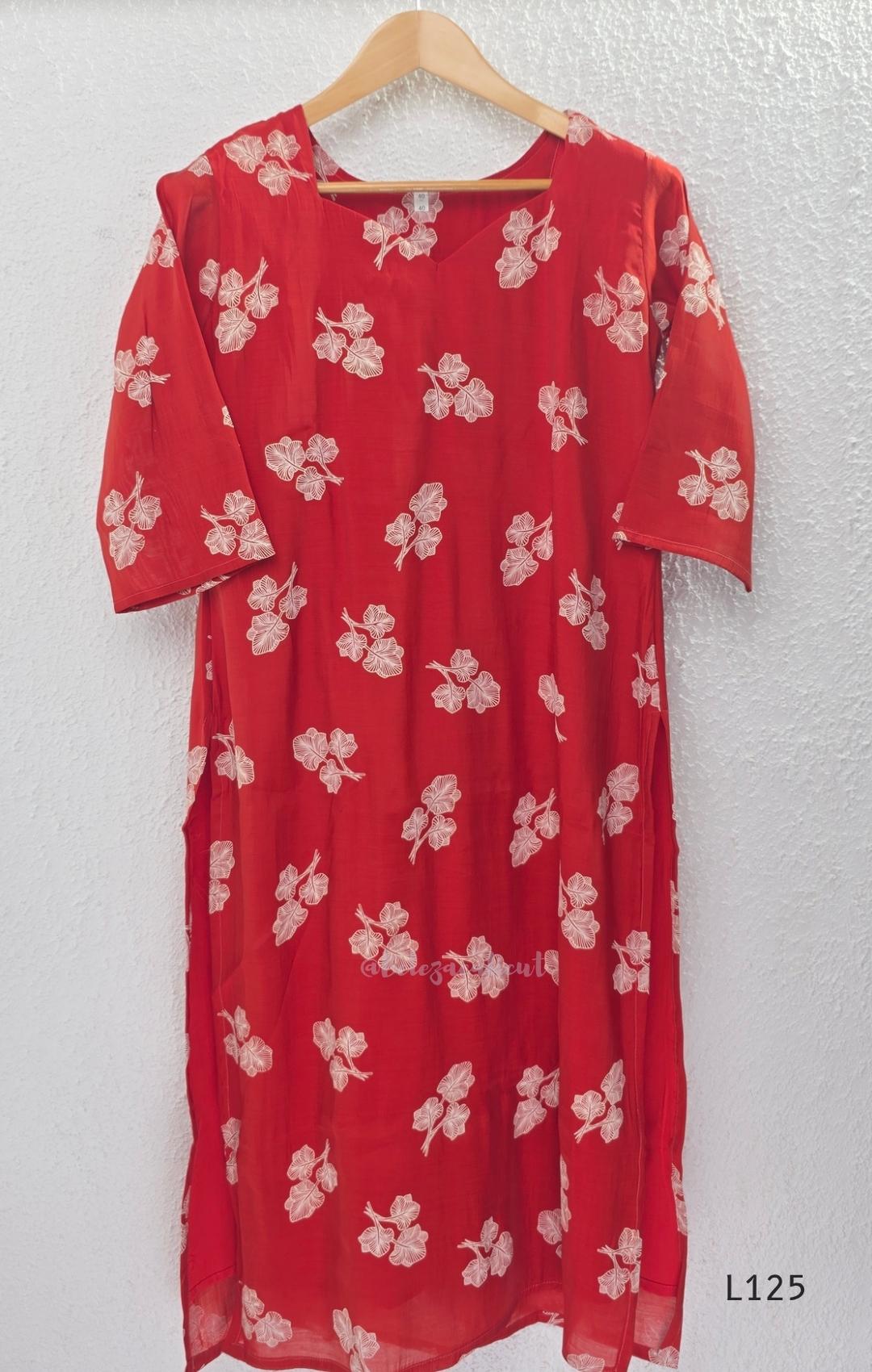 Red mul chanderi coord set with white botanical print top and matching plain straight pants.