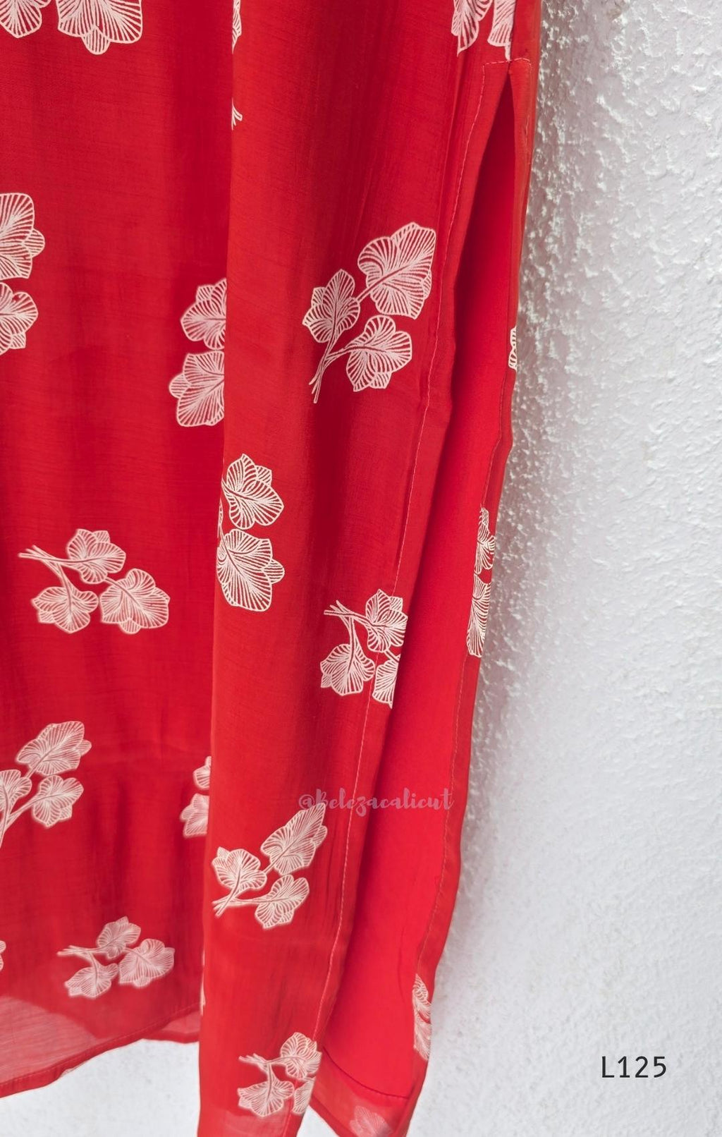 Red mul chanderi coord set with white botanical print top and matching plain straight pants.