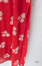 Red mul chanderi coord set with white botanical print top and matching plain straight pants.