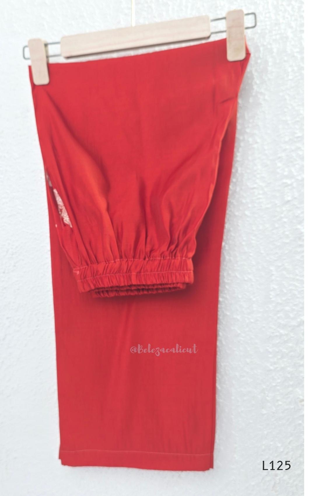 Red mul chanderi coord set with white botanical print top and matching plain straight pants.