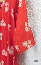 Red mul chanderi coord set with white botanical print top and matching plain straight pants.