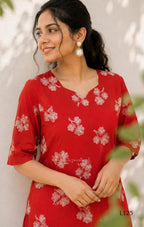 Red mul chanderi coord set with white botanical print top and matching plain straight pants.