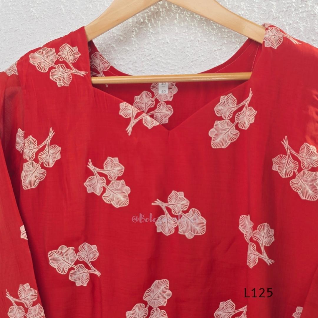 Red mul chanderi coord set with white botanical print top and matching plain straight pants.