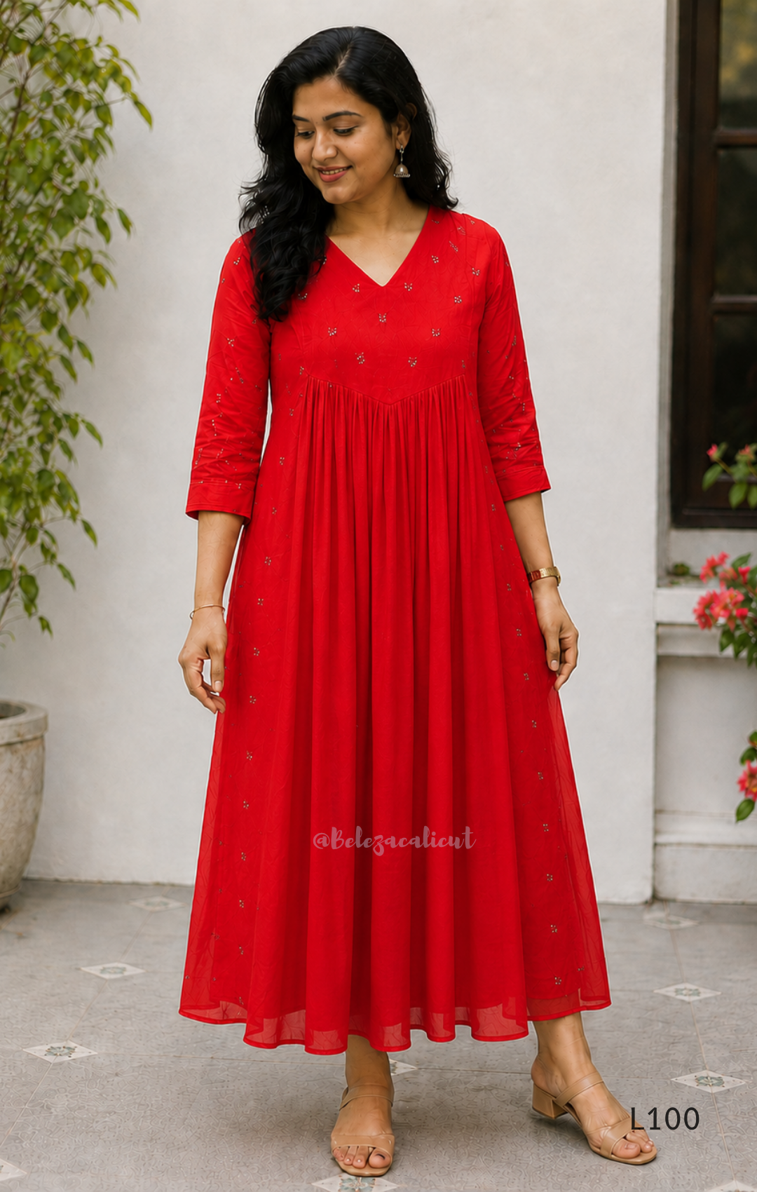 Red mul chanderi A-line kurti with V-neck, gathered front panel, 3/4 sleeves and small scattered embroidery.
