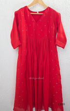 Red mul chanderi A-line kurti with V-neck, gathered front panel, 3/4 sleeves and small scattered embroidery.
