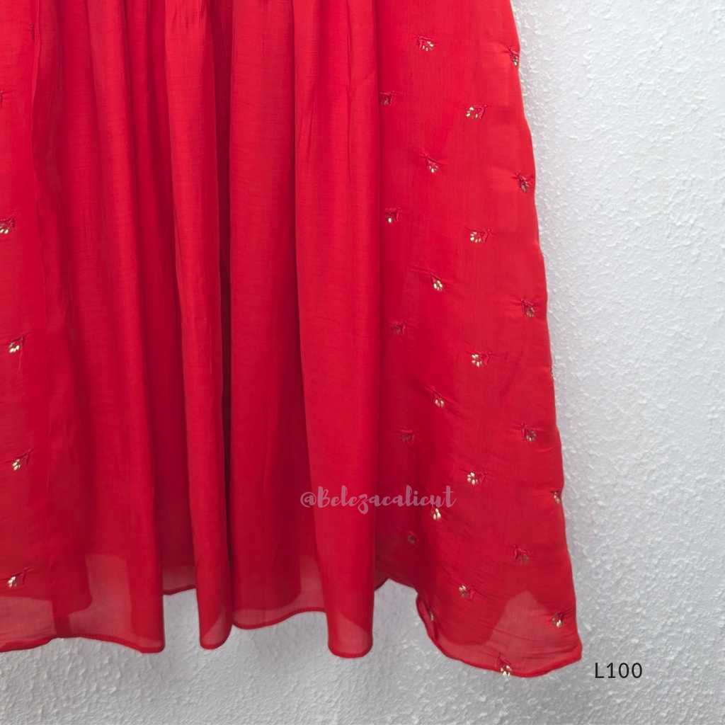 Red mul chanderi A-line kurti with V-neck, gathered front panel, 3/4 sleeves and small scattered embroidery.