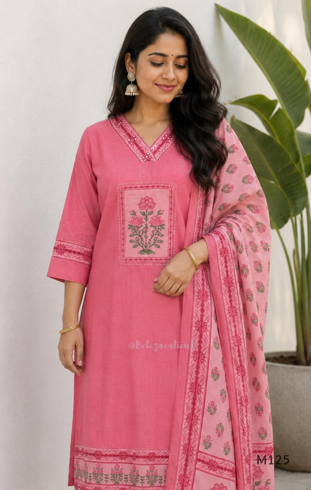 Rose pink silk blend 3-piece churidar set with floral patch panels, decorated V-neck, loose plain bottom and printed floral dupatta.