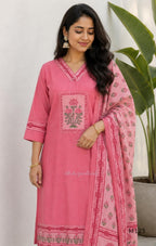 Rose pink silk blend 3-piece churidar set with floral patch panels, decorated V-neck, loose plain bottom and printed floral dupatta.