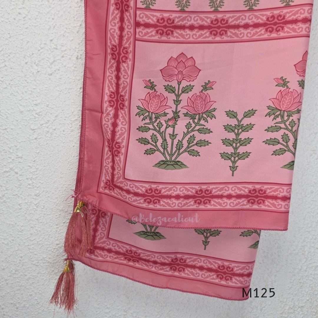 Rose pink silk blend 3-piece churidar set with floral patch panels, decorated V-neck, loose plain bottom and printed floral dupatta.