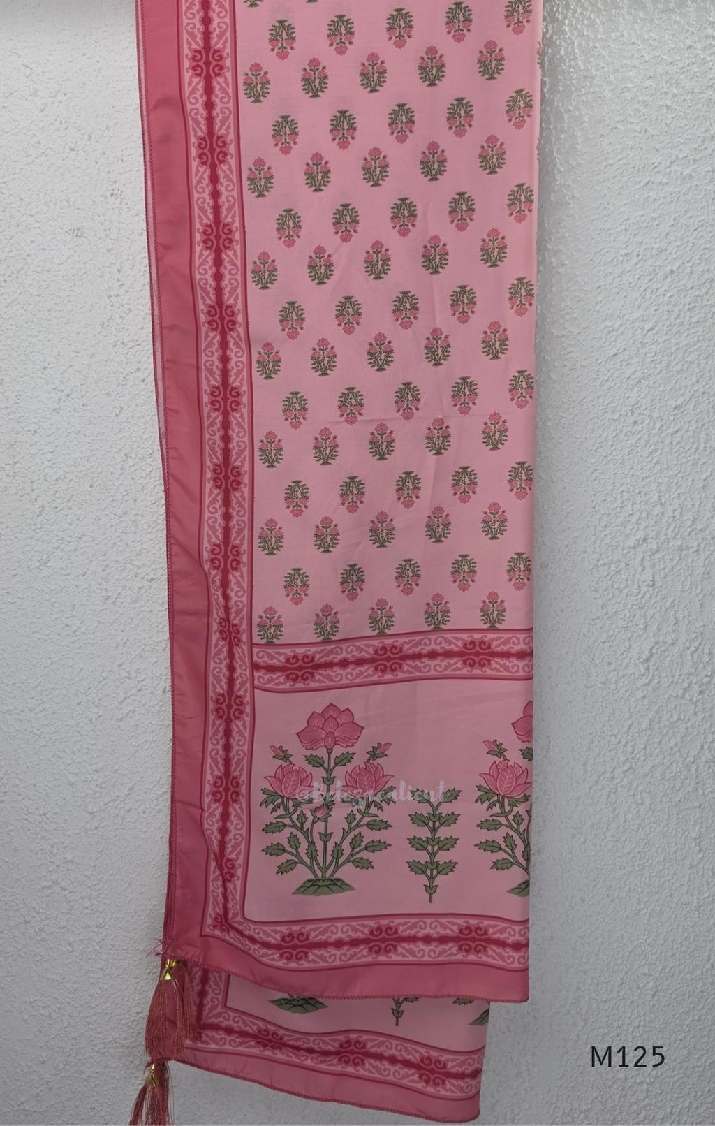 Rose pink silk blend 3-piece churidar set with floral patch panels, decorated V-neck, loose plain bottom and printed floral dupatta.