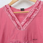 Rose pink silk blend 3-piece churidar set with floral patch panels, decorated V-neck, loose plain bottom and printed floral dupatta.