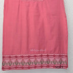 Rose pink silk blend 3-piece churidar set with floral patch panels, decorated V-neck, loose plain bottom and printed floral dupatta.