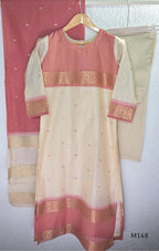 Rose pink and ivory tissue blend churidar set with woven gold borders, scattered motifs, straight bottom and matching dupatta.