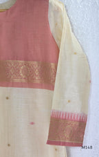 Rose pink and ivory tissue blend churidar set with woven gold borders, scattered motifs, straight bottom and matching dupatta.